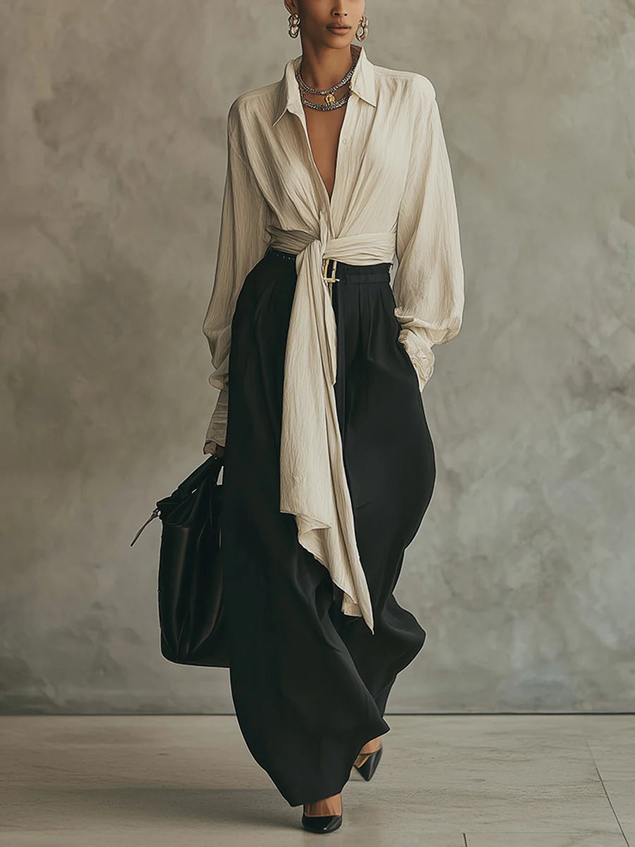 Completo camicia beige con lacci e pantaloni neri