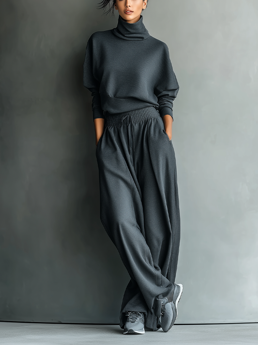 Set da donna in maglia di carbone con collo alto e pantaloni a gamba larga